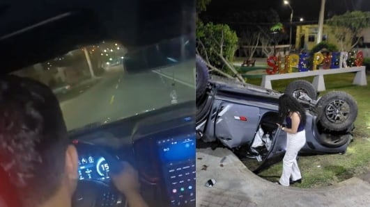 La camioneta, de placa CCG-883, impactó contra barandas y muros de concreto antes de volcar y quedar con las llantas hacia arriba en un área verde.