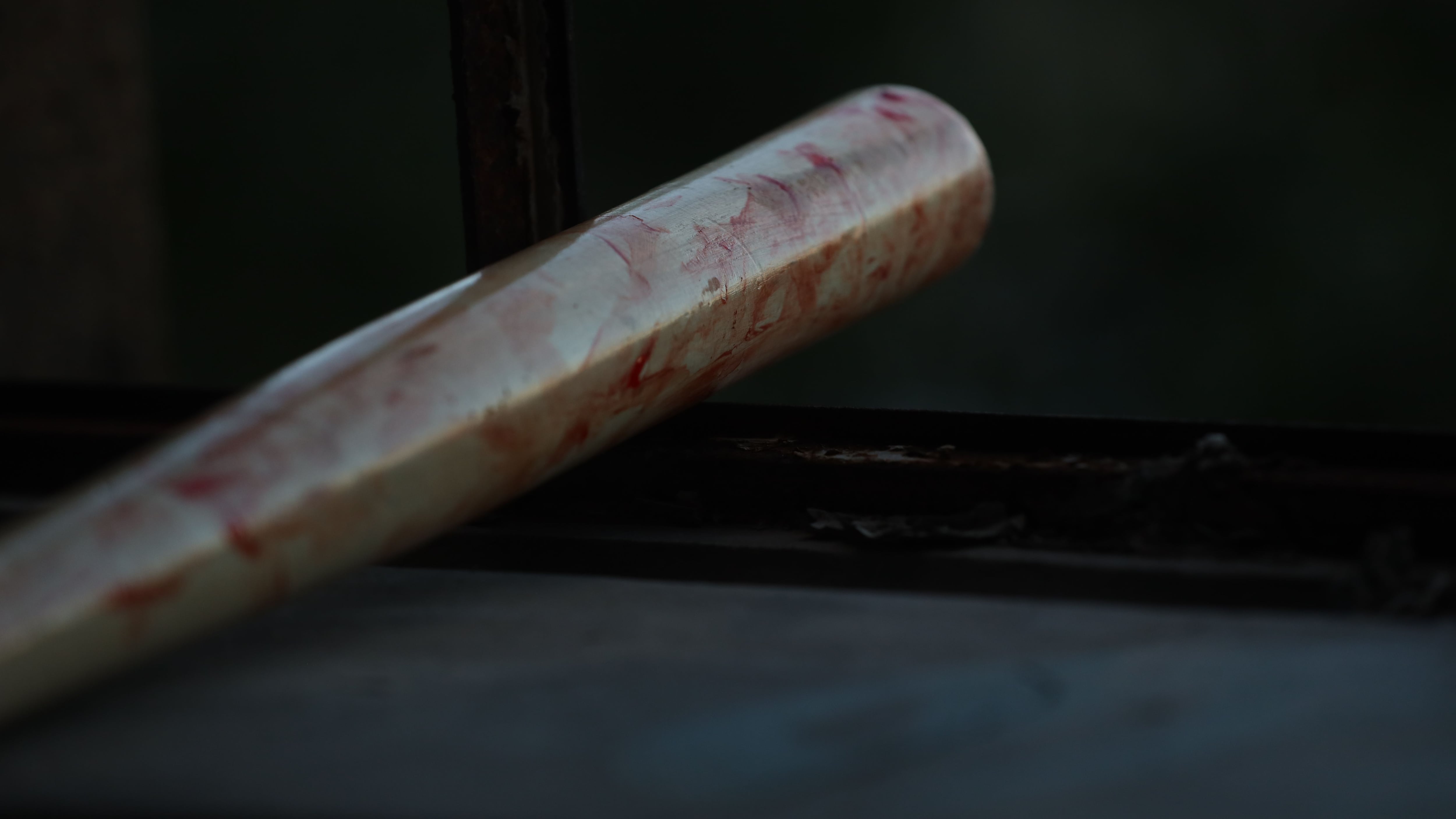 Closeup shot of a painted baseball bat in a cinematic style