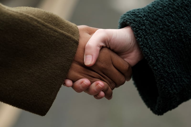 Two businesspeople shaking hands, showing mutual respect and successful negotiation, creating a powerful image of collaboration and partnership