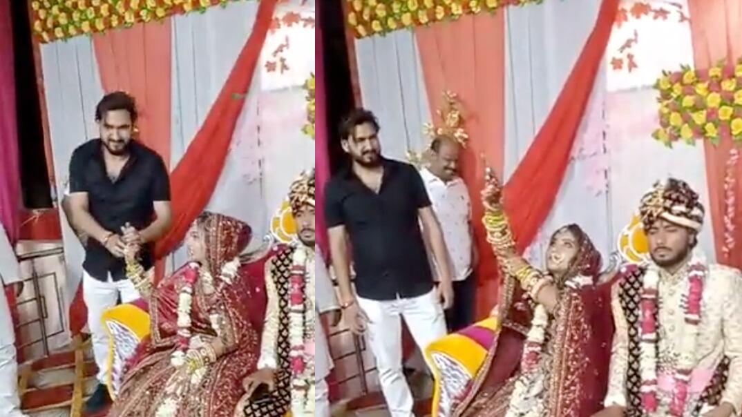 Novia india disparando al aire en su boda