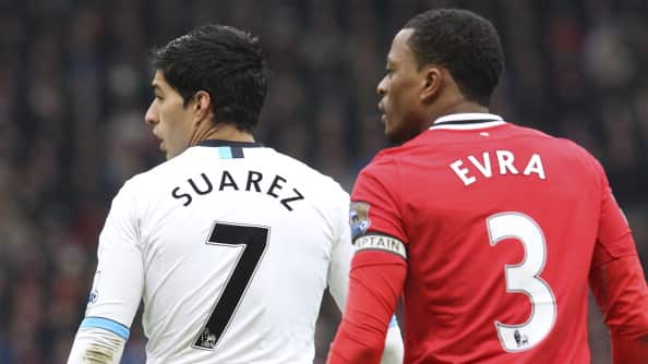 Luis Suárez y Patrice Evra.