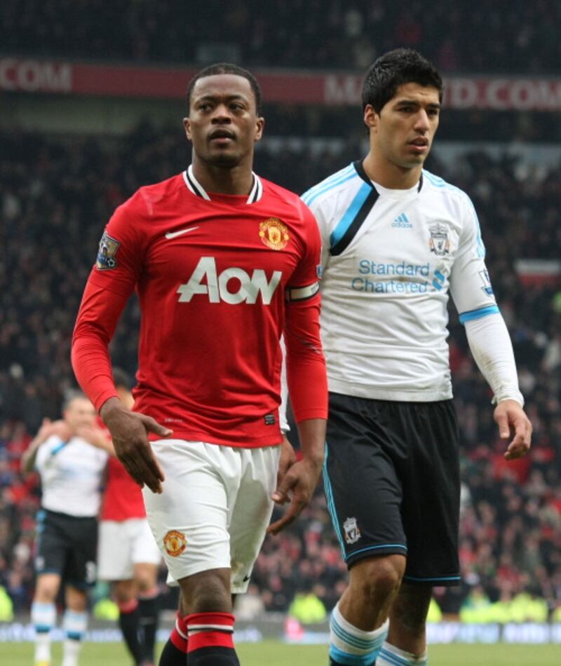 Luis Suárez y Patrice Evra.