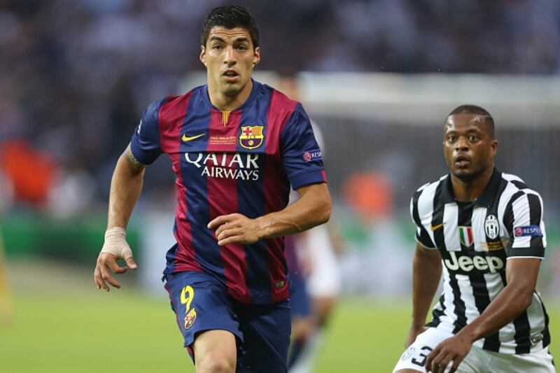 Luis Suárez y Patrice Evra.