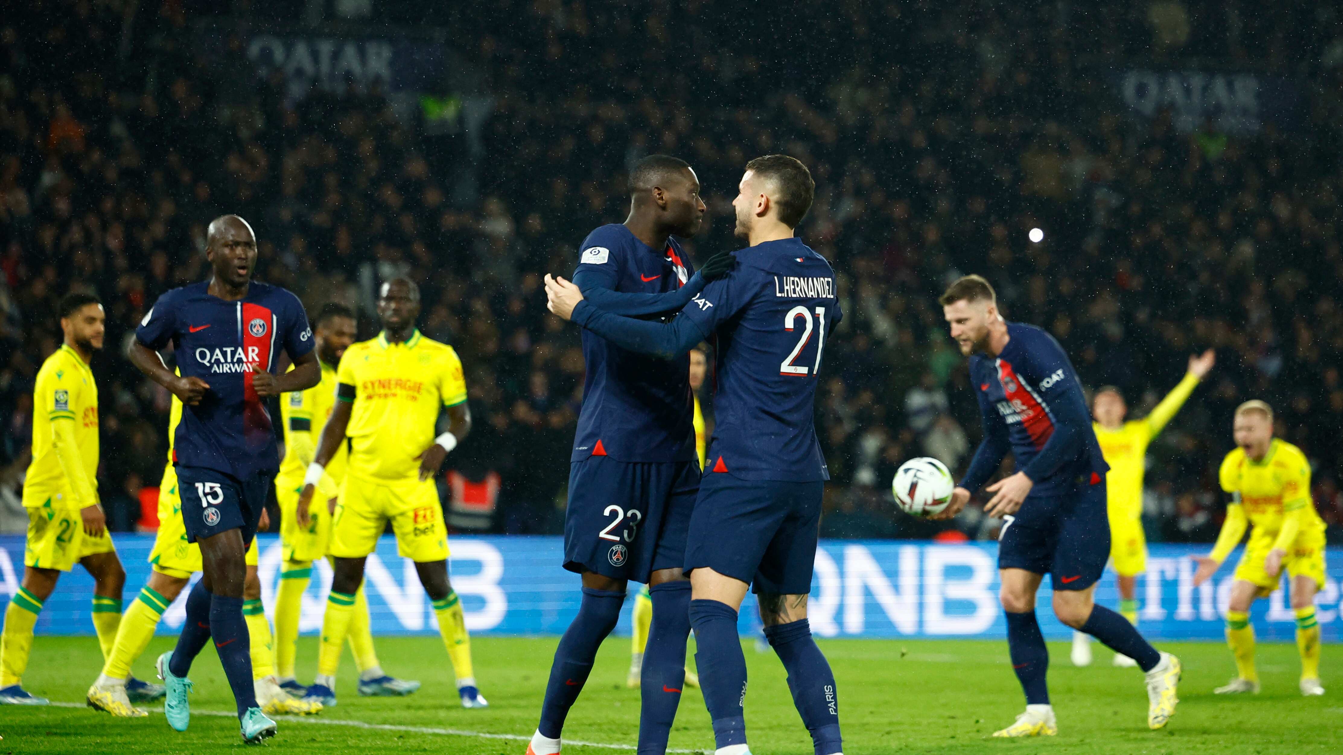 Soccer Football - Ligue 1 - Paris St Germain v Nantes - Parc des Princes, Paris, France - December 9, 2023 Paris St Germain's Randal Kolo Muani celebrates scoring their second goal with Lucas Hernandez REUTERS/Sarah Meyssonnier